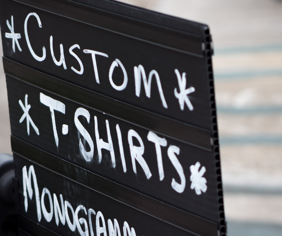 Sign that says "Custom T-shirts"