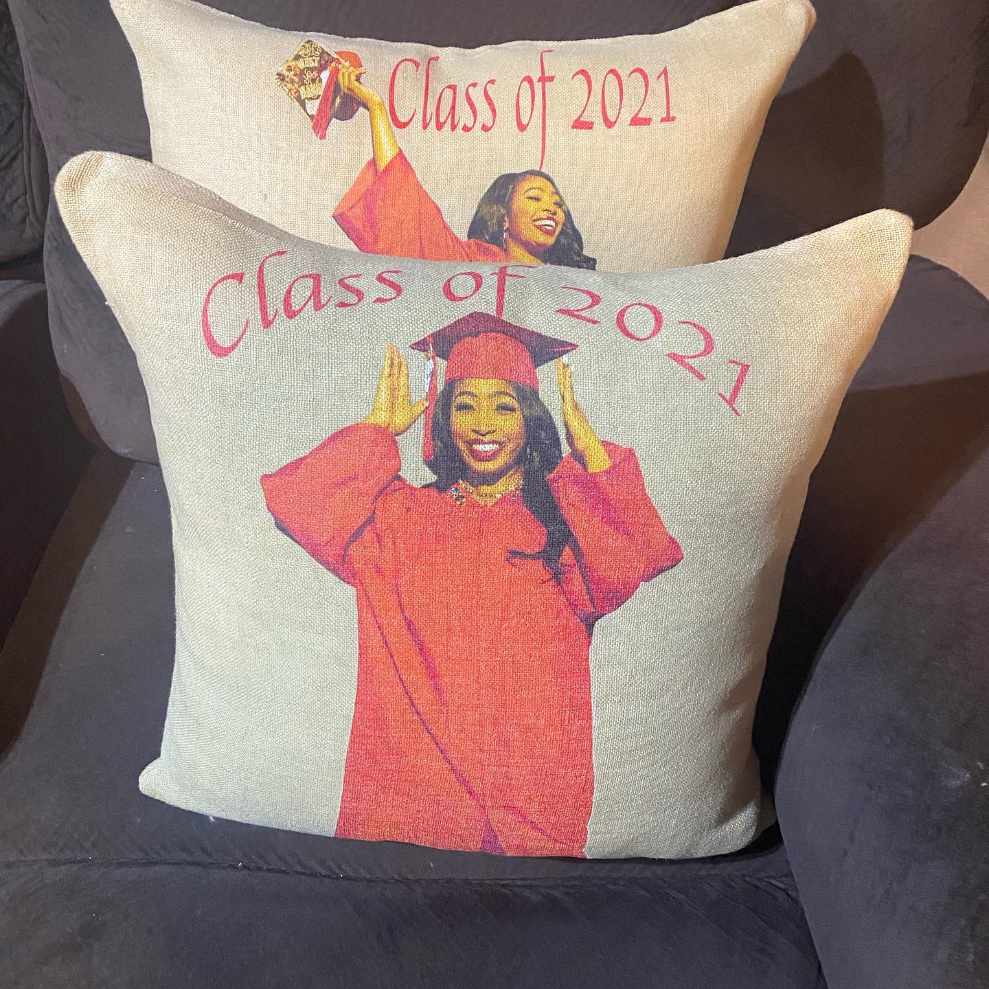 Two pillows that have custom pictures of a woman graduating with the words "Class of 2021" 