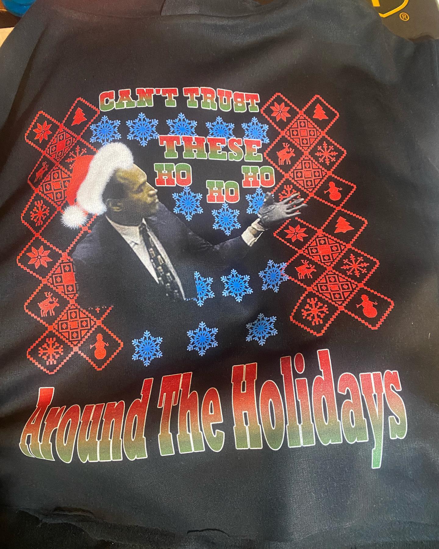 Custom graphic T-shirt with the words "Can't trust these ho ho ho around the holidays"